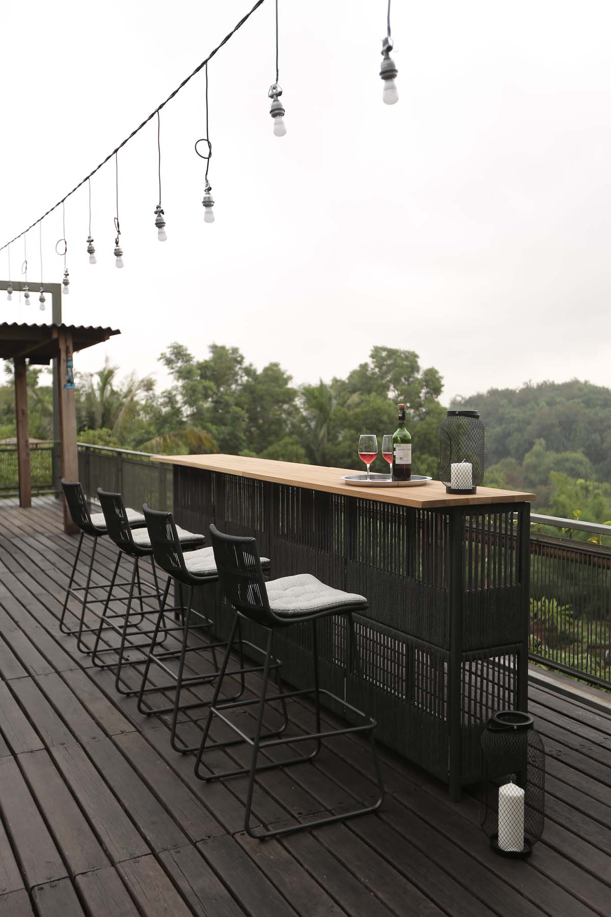 Outdoor bar counter and bar chairs