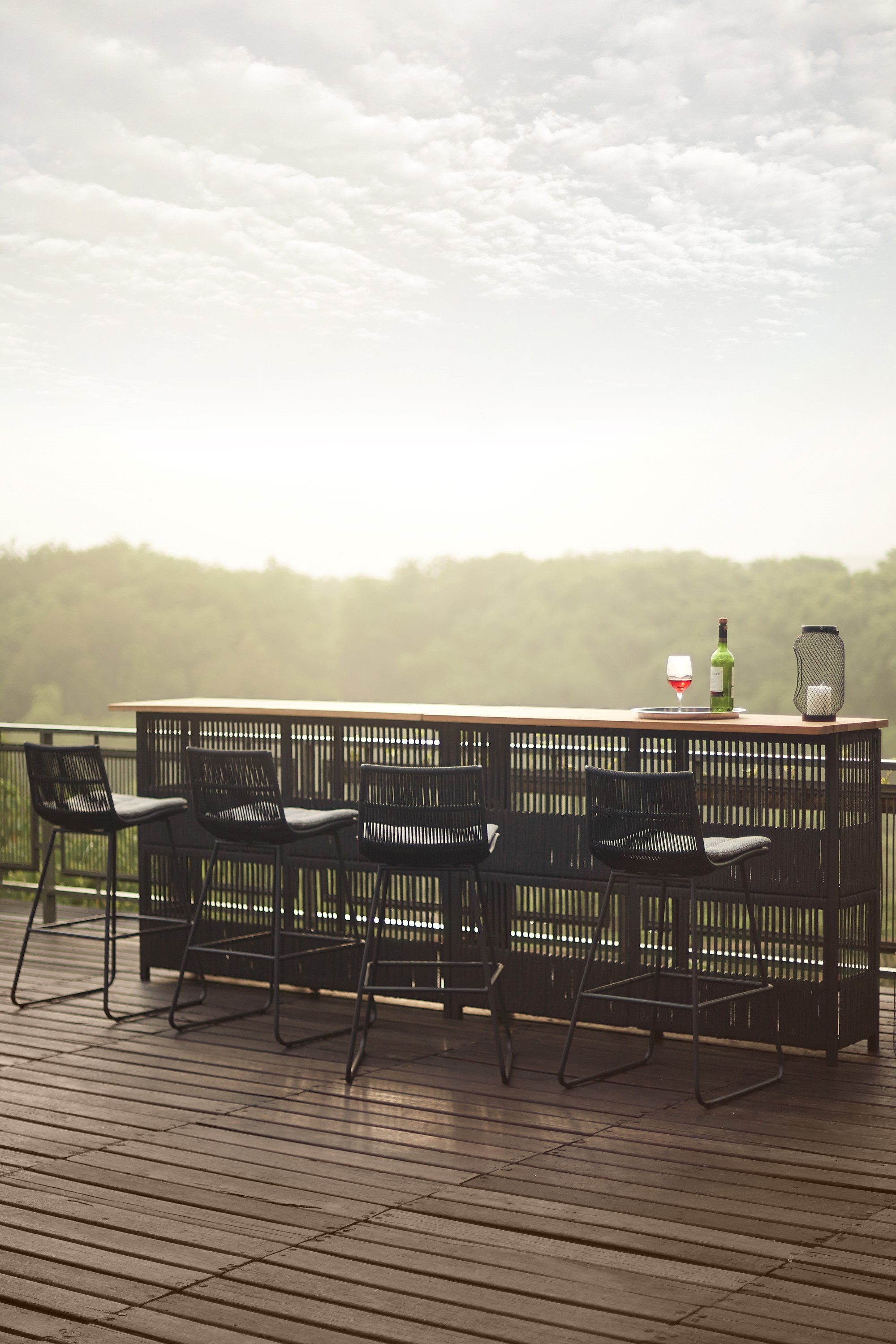 Outdoor bar counter and bar chairs